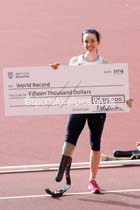 Stef Reid (GB) with a cheque for 15,000 dollars after winning the F44 long jump with a world record 5.47 metres at the Glasgow Diamond League. Photo: David T. Hewitson/Sports for All Pics